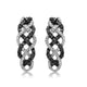 Load image into Gallery viewer, Jewelili Twisted Hoop Earrings with Natural White and Treated Black Round Diamonds in Sterling Silver 1/2 CTTW view 1
