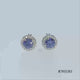 Load and play video in Gallery viewer, Jewelili Sterling Silver With Tanzanite and Cubic Zirconia Halo Stud Earrings
